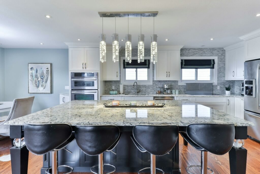 a kitchen with a marble island