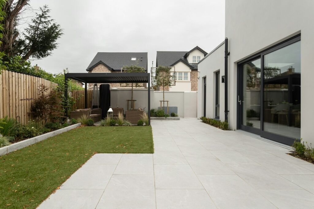 a house with a large yard and a covered patio
